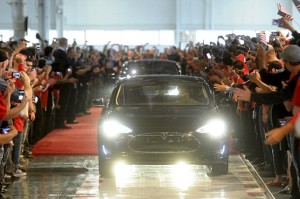 A customer drives a Model S out of Tesla's factory in Fremont